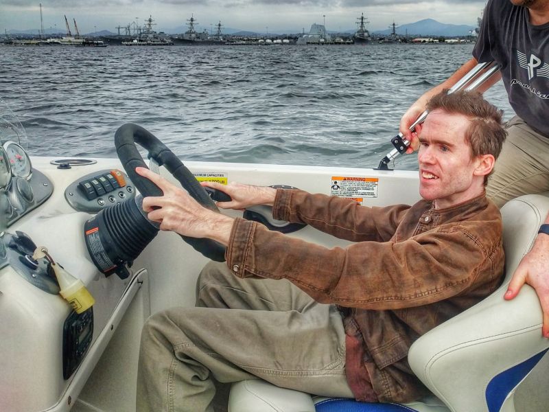 Mick driving a speedboat