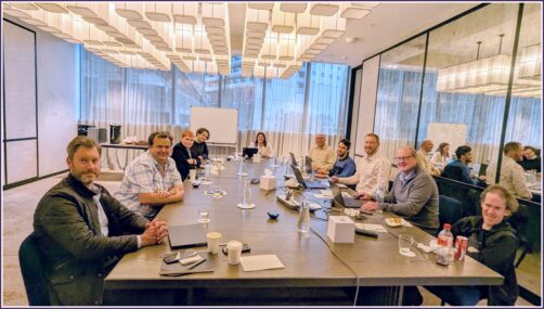 NV Access board and staff seated around a large table in a well-lit room in Melbourne, May 2025