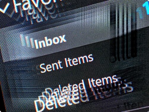 Image of email folder names (inbox, sent items, deleted items) zooming in so the outer items repeat over the top of themselves.  Image is white text on dark with a slight tint around the edges of the text